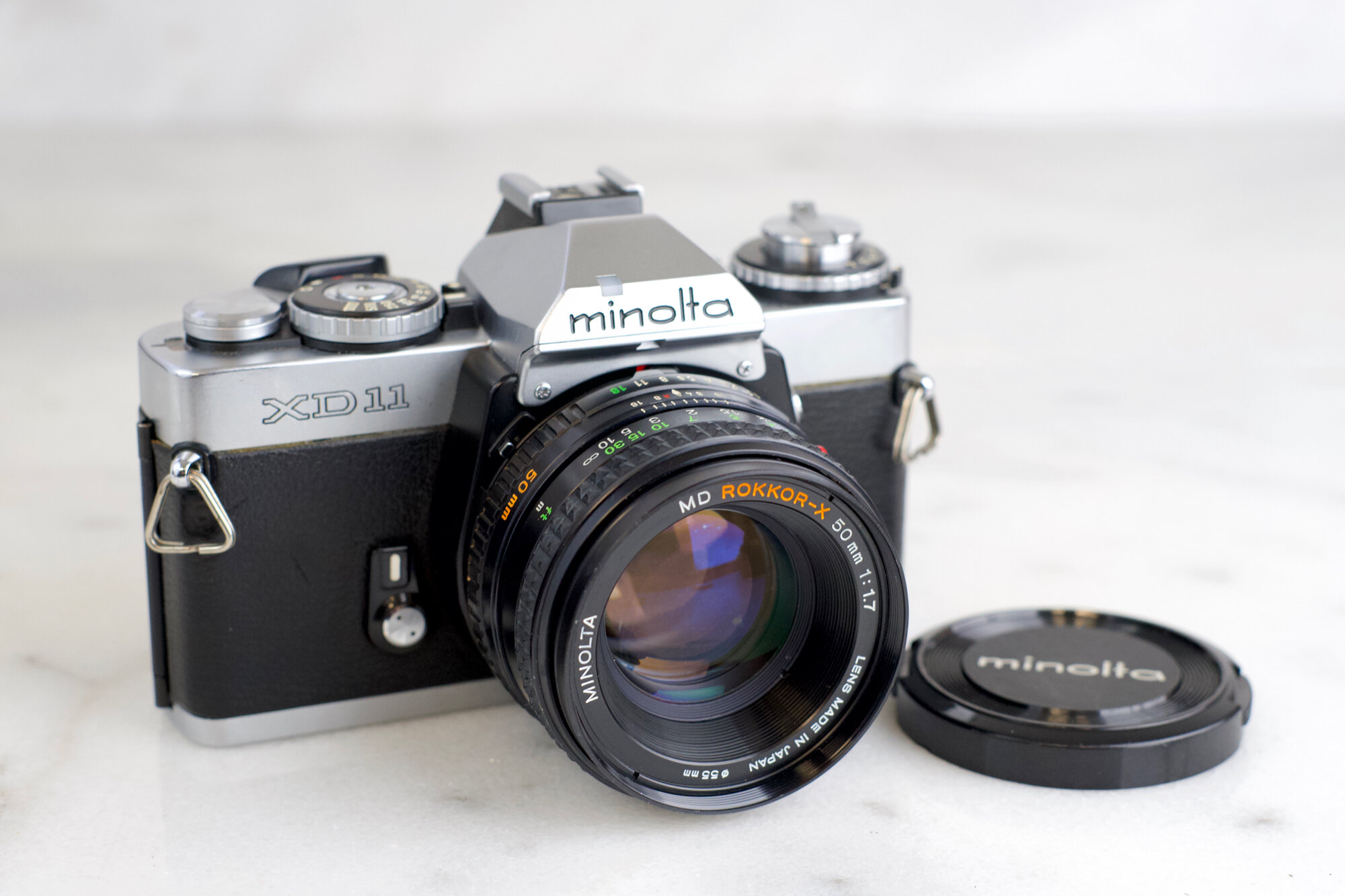 Minolta XD11 35mm Film SLR Camera with Minolta MD Rokkor X 50mm F/1.7, Lens  Cap, Batteries — F Stop Cameras